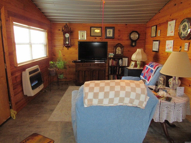 living room with lofted ceiling, wooden walls, and heating unit