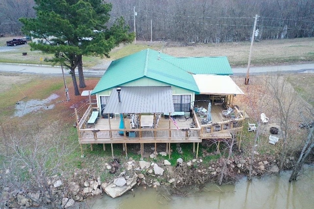 back of house featuring a deck with water view