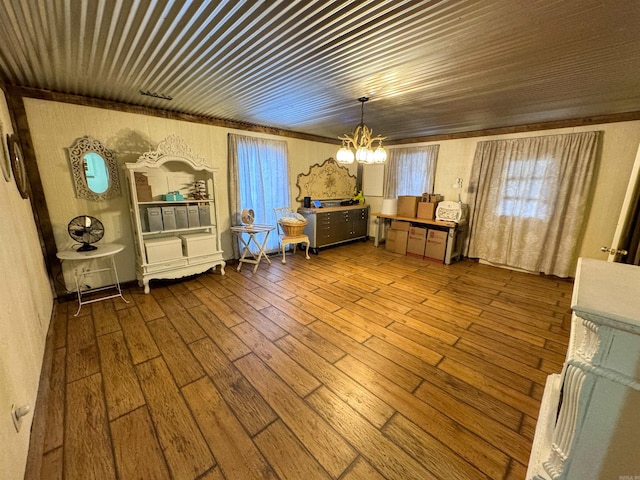 interior space with an inviting chandelier and hardwood / wood-style flooring