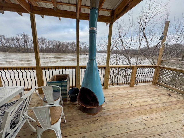 wooden deck with a water view