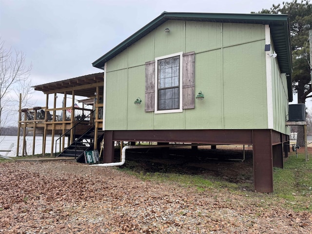 view of side of home with a water view