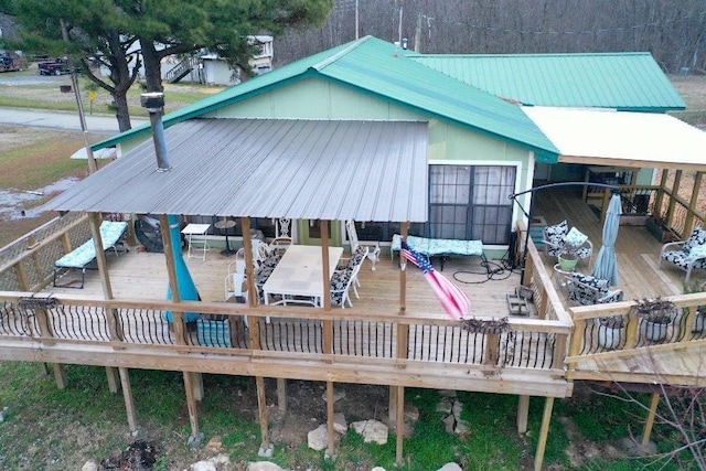 rear view of house with a wooden deck