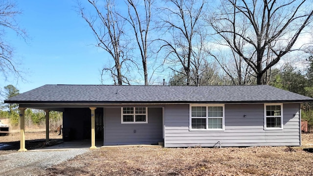 ranch-style home featuring a carport