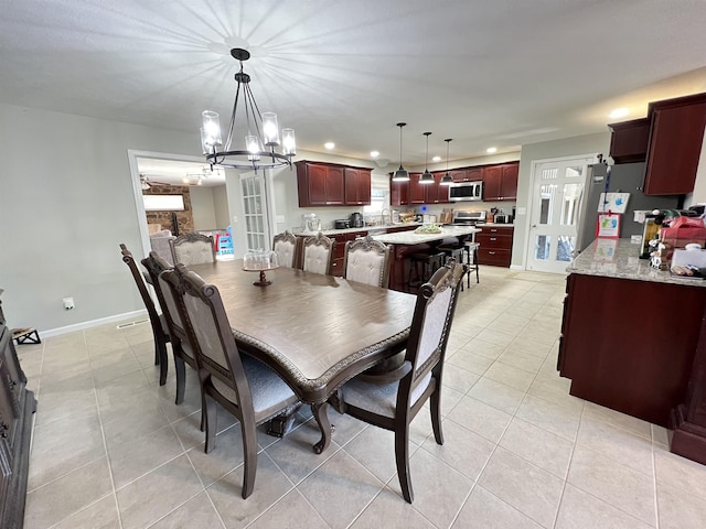 tiled dining space featuring sink