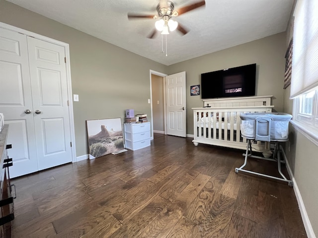 bedroom featuring dark hardwood / wood-style flooring and ceiling fan