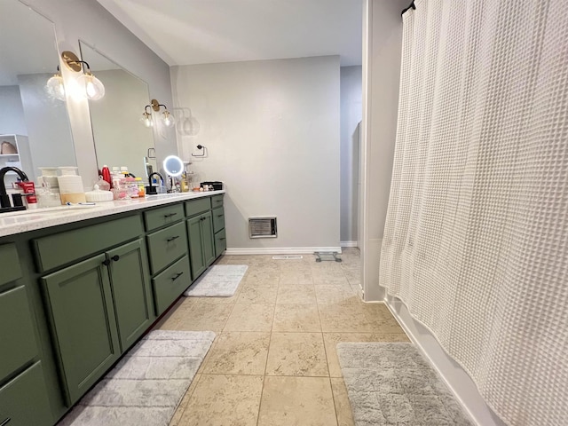 bathroom featuring a shower with shower curtain, vanity, and tile patterned flooring