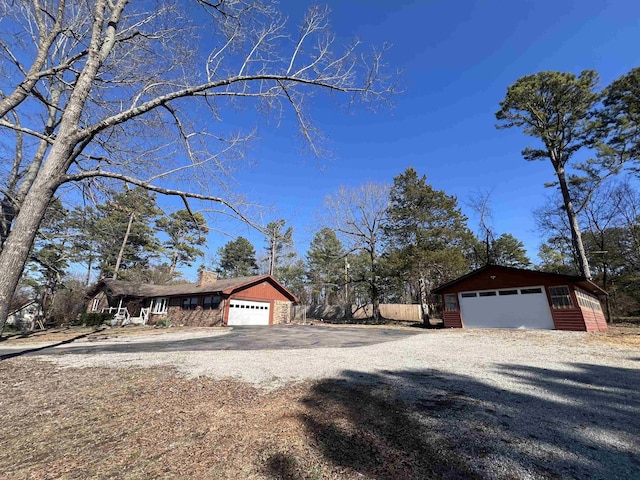 view of home's exterior with an outbuilding and a garage