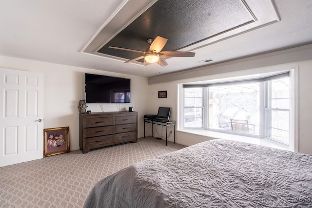 bedroom featuring ceiling fan and light colored carpet