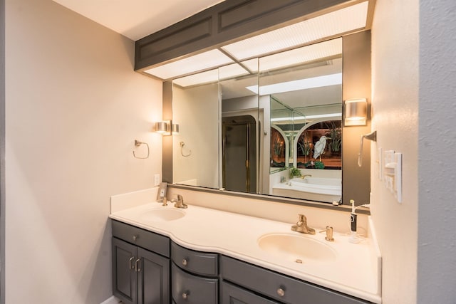 bathroom featuring vanity and shower with separate bathtub