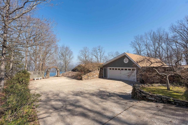 view of side of property featuring a garage