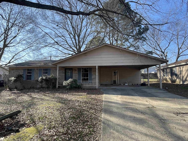 view of front of home with a carport and covered porch