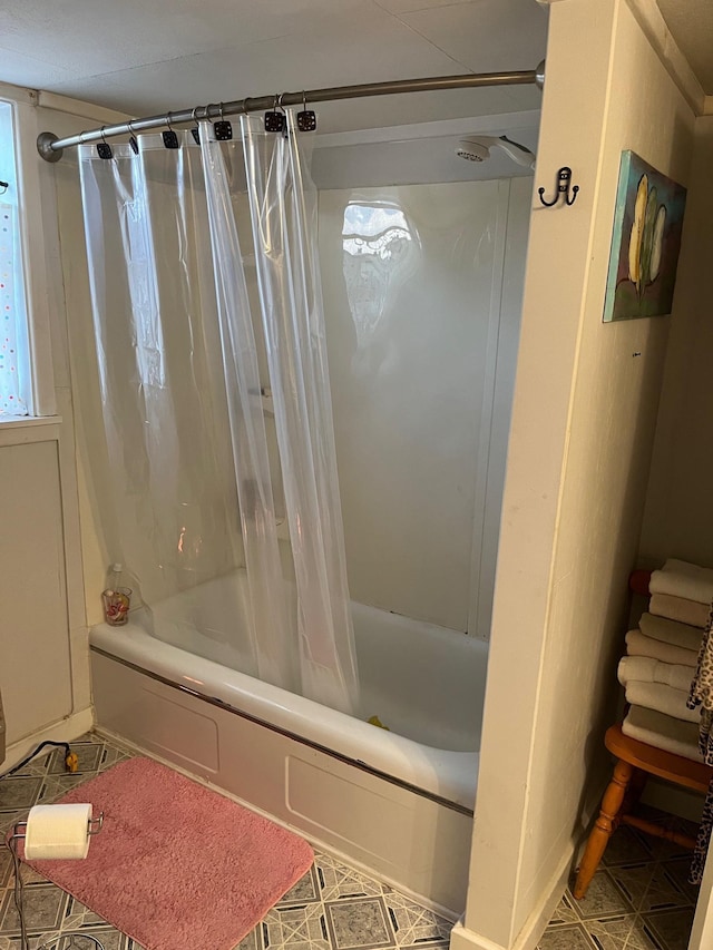 bathroom featuring shower / bathtub combination with curtain