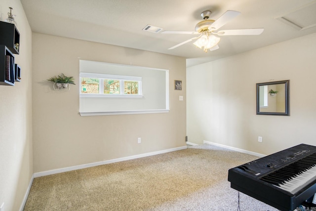 unfurnished room featuring carpet flooring and ceiling fan