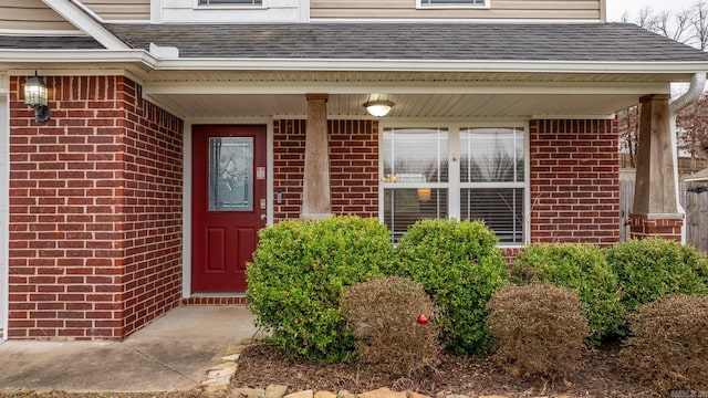 property entrance featuring a porch