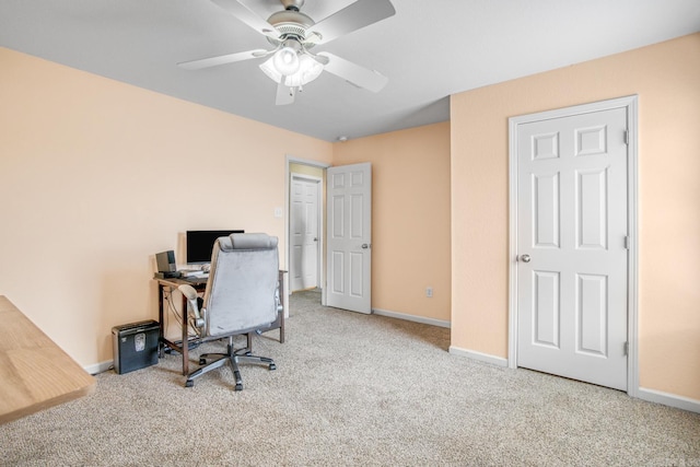 office featuring light carpet and ceiling fan