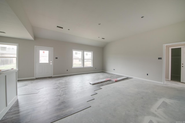 interior space with lofted ceiling and light hardwood / wood-style flooring