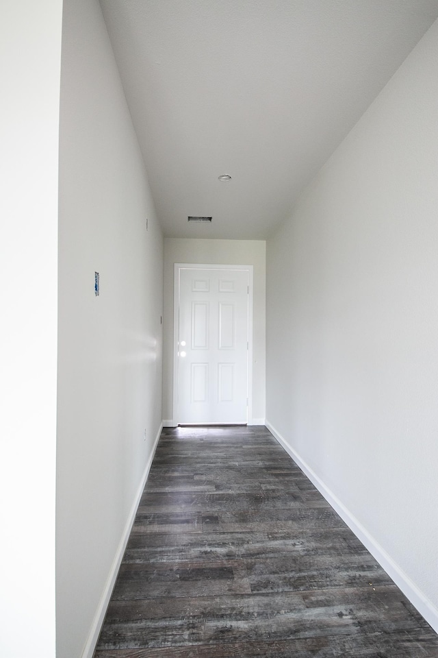 unfurnished room featuring dark hardwood / wood-style floors