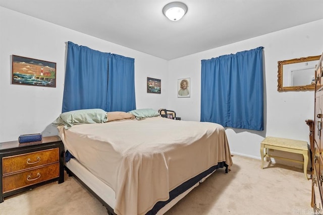 bedroom featuring light colored carpet