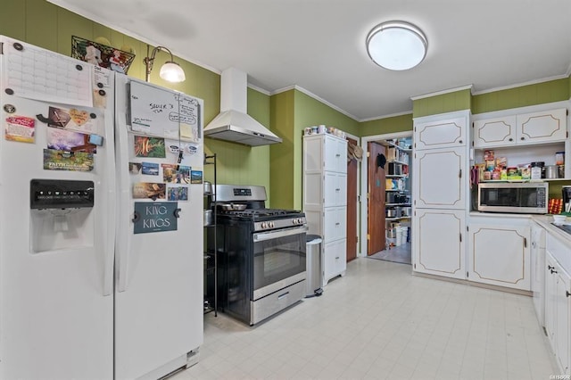 kitchen with white cabinetry, wall chimney range hood, crown molding, and stainless steel appliances