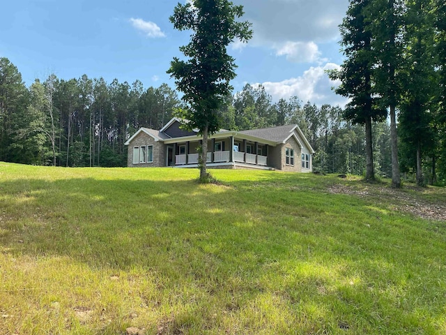 ranch-style house featuring a front lawn