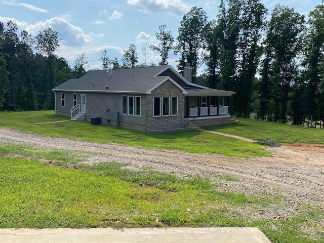 view of property exterior featuring a yard and central AC unit