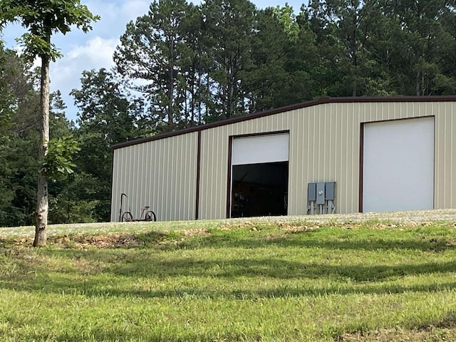 view of outbuilding featuring a yard