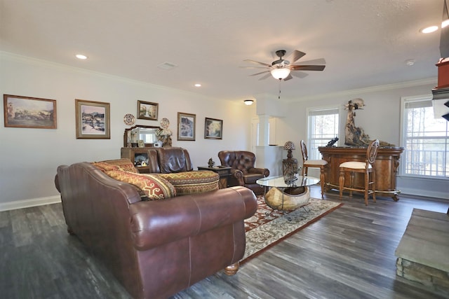 living room with dark wood-type flooring, ceiling fan, and ornamental molding