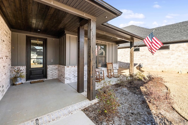 view of exterior entry featuring a patio