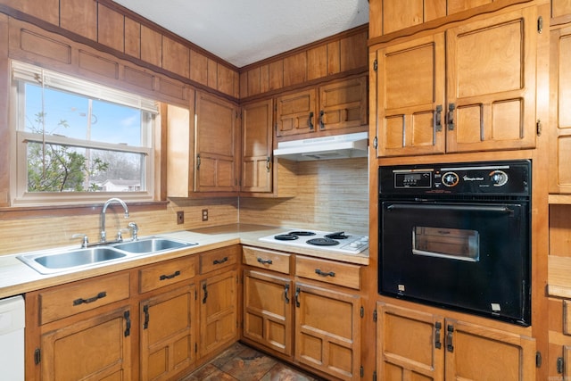 kitchen with crown molding, sink, backsplash, and white appliances