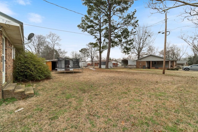 view of yard with a trampoline