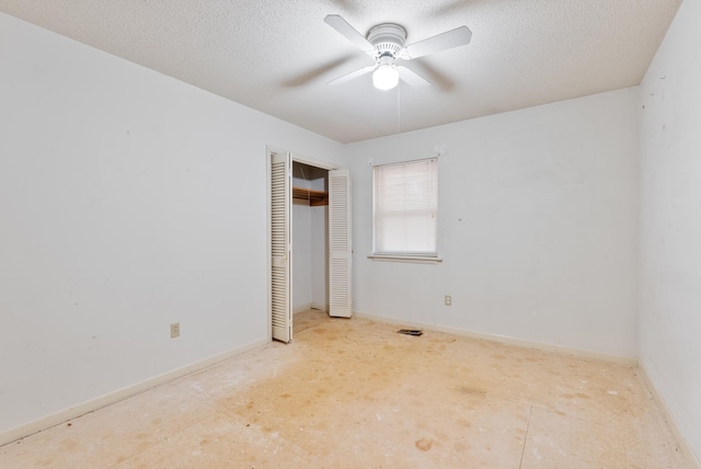 spare room featuring ceiling fan and a textured ceiling