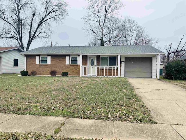 ranch-style home with a garage, a front yard, and covered porch