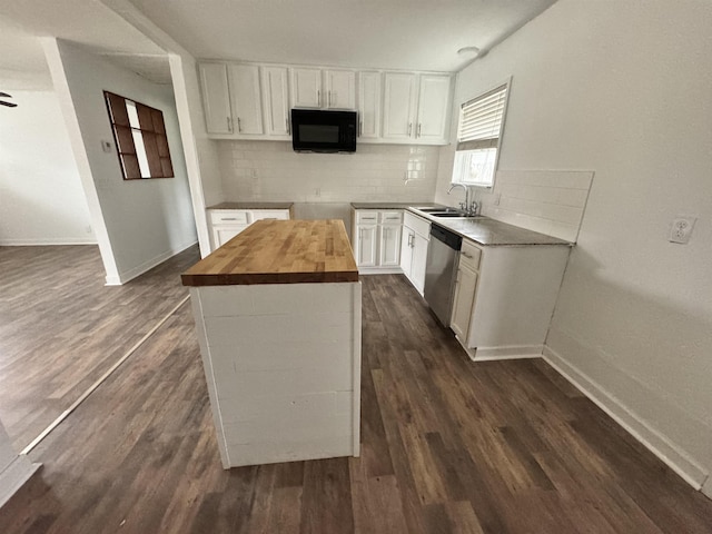 kitchen with butcher block countertops, dishwasher, a center island, white cabinets, and dark hardwood / wood-style flooring