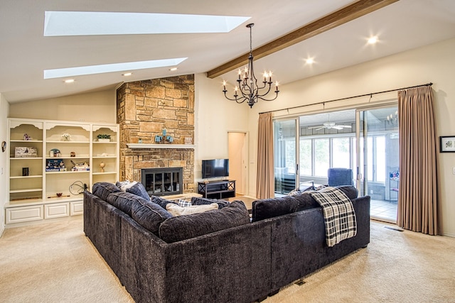 carpeted living room with high vaulted ceiling, a skylight, beamed ceiling, and a stone fireplace