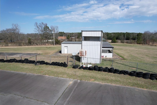 view of outbuilding with a lawn