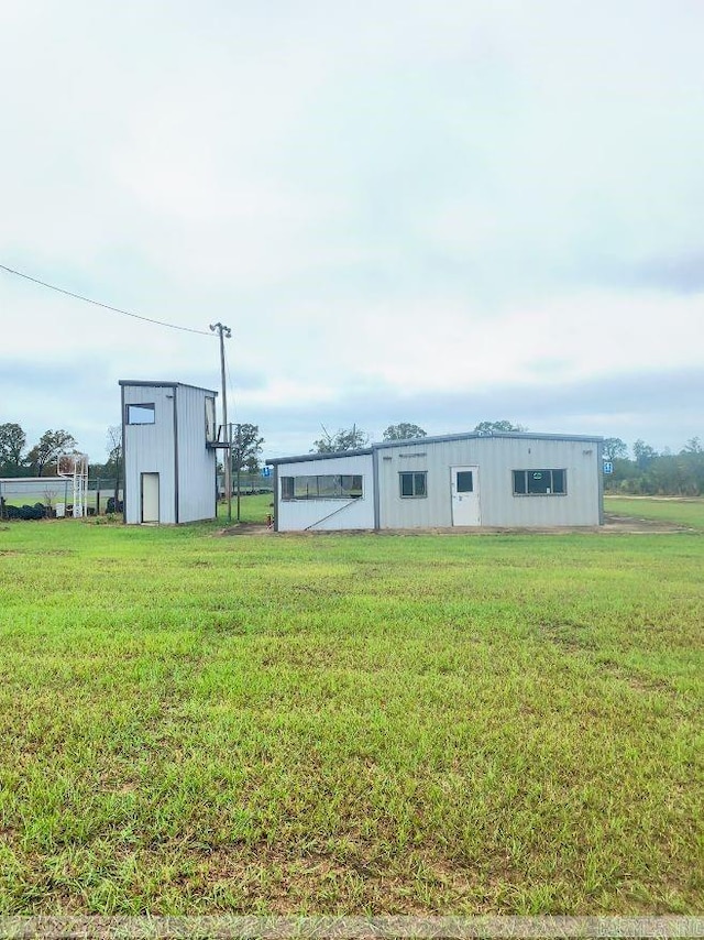 view of outdoor structure with a lawn