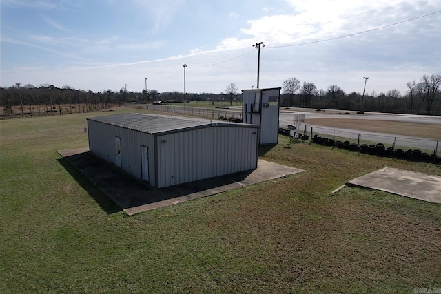 view of outdoor structure with a lawn