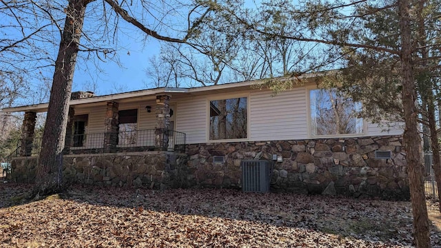 view of front of home with central AC and a porch