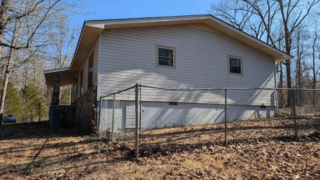 view of side of home featuring a garage