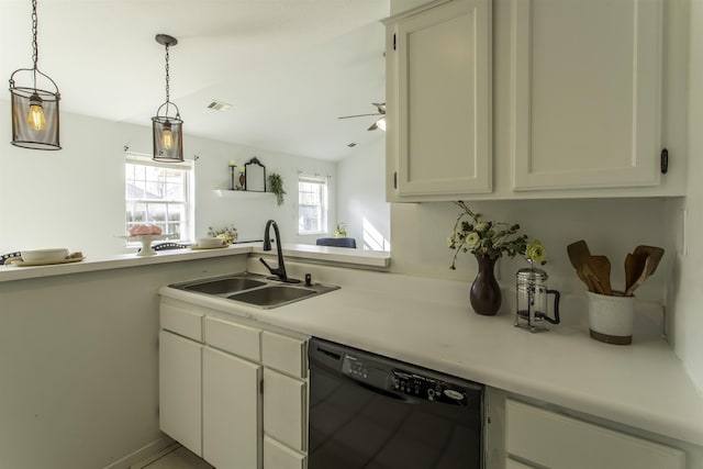 kitchen featuring sink, black dishwasher, pendant lighting, ceiling fan, and white cabinets