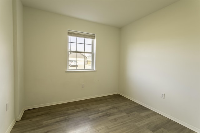 empty room featuring dark wood-type flooring