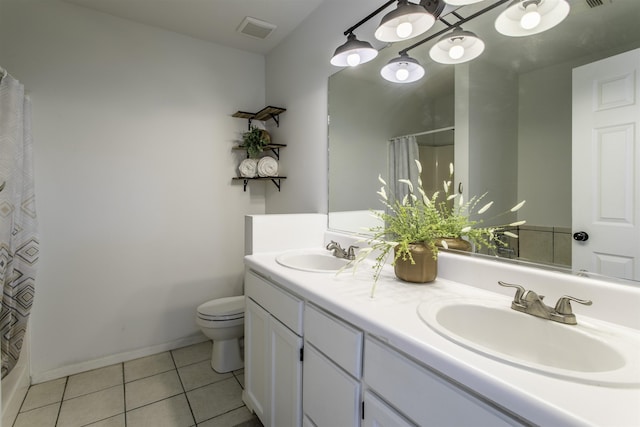 bathroom featuring tile patterned floors, toilet, curtained shower, and vanity