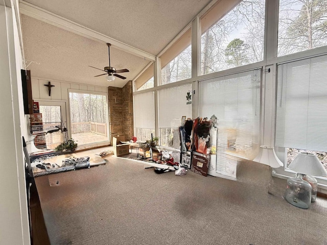 interior space featuring floor to ceiling windows, high vaulted ceiling, a textured ceiling, carpet floors, and ceiling fan