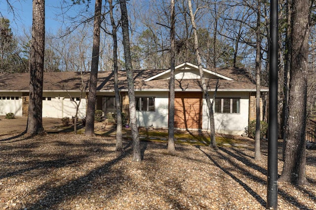 ranch-style home with a garage