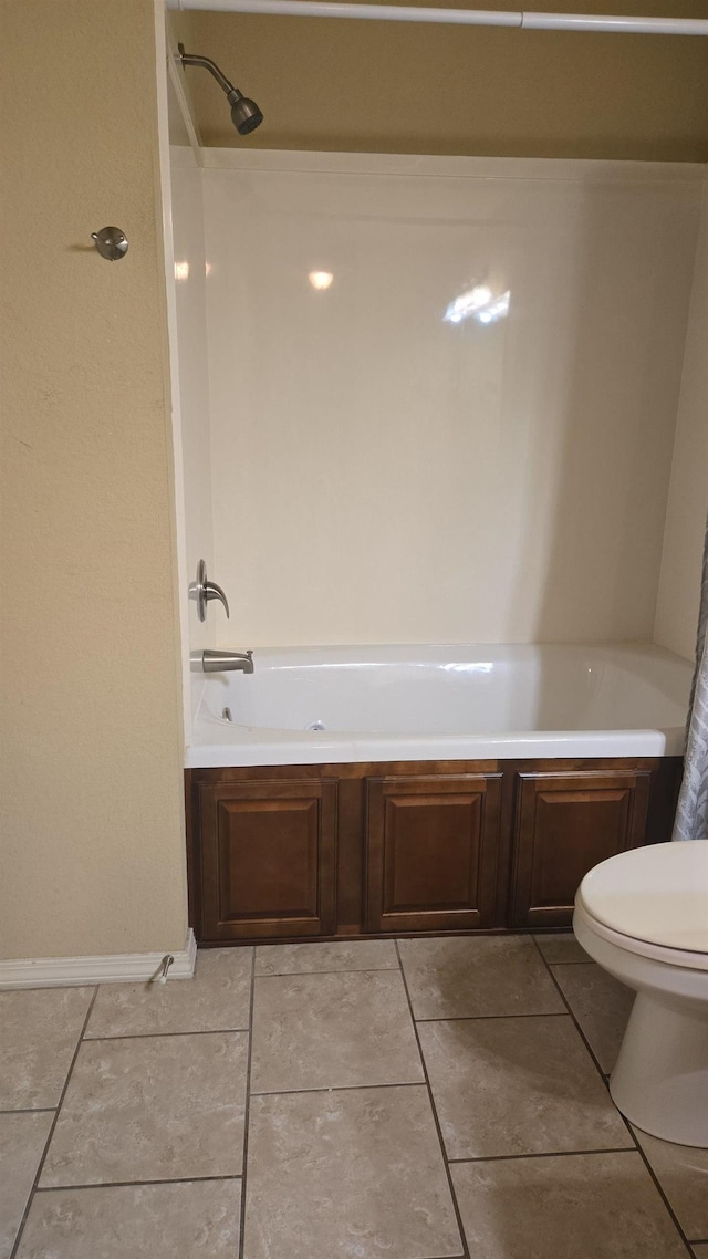 bathroom with tile patterned flooring and toilet