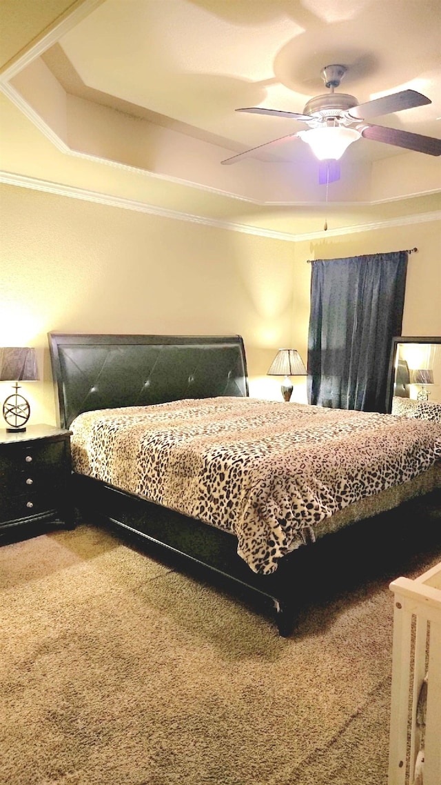 bedroom featuring crown molding, carpet flooring, and ceiling fan