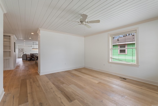 empty room featuring ornamental molding, ceiling fan, wooden ceiling, and light hardwood / wood-style floors