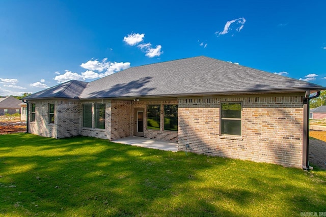 back of house featuring a yard and a patio area