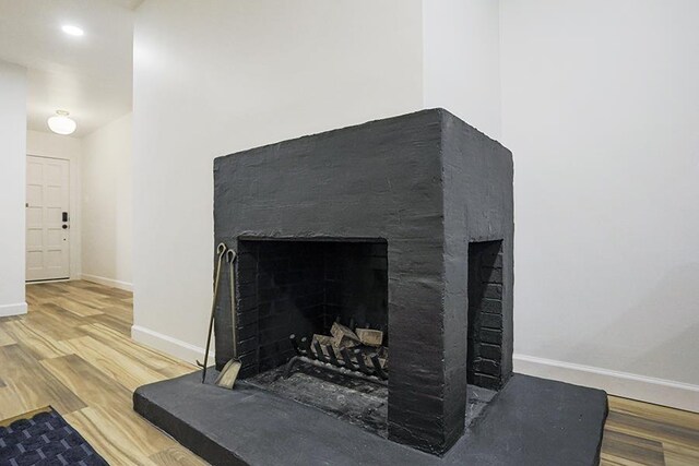interior details featuring hardwood / wood-style flooring