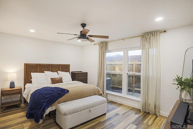 bedroom with hardwood / wood-style flooring and ceiling fan